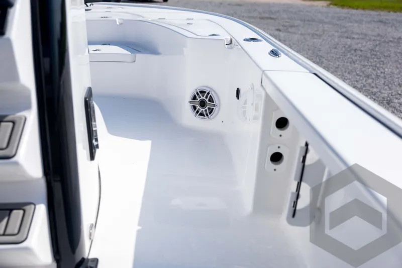Slide: The Image of 2026 Tidewater 2410 Bay Max boat interior with speaker and storage compartments. - 25