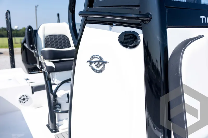 Slide: The Image of 2026 Tidewater 2410 Bay Max boat interior with seating and logo detail. - 26