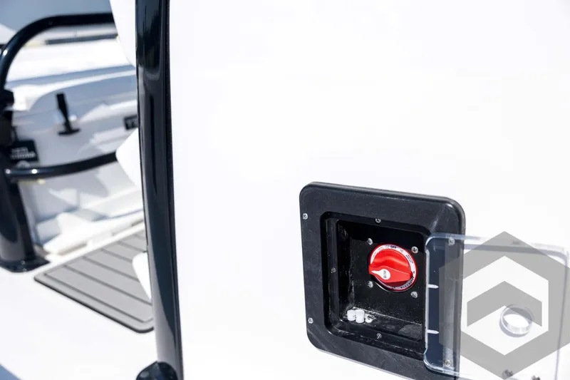 Slide: The Image of 2026 Tidewater 2410 Bay Max boat detail with red switch and storage compartment. - 28