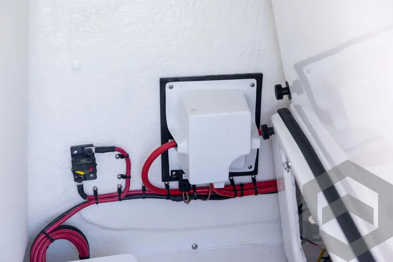 Slide: The Image of Electrical wiring setup in a 2026 Tidewater 2410 Bay Max boat compartment. - 34