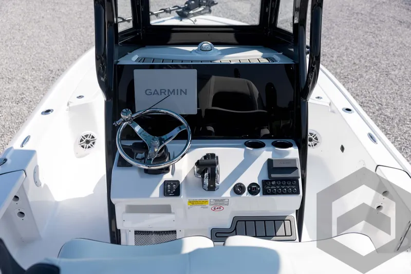 Slide: The Image of 2026 Tidewater 2410 Bay Max boat console with Garmin navigation system and steering wheel. - 35