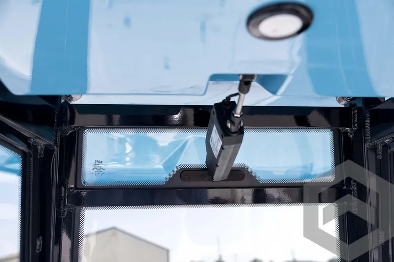 Slide: The Image of Interior view of 2026 Tidewater 2410 Bay Max boat with blue accents and modern design. - 37