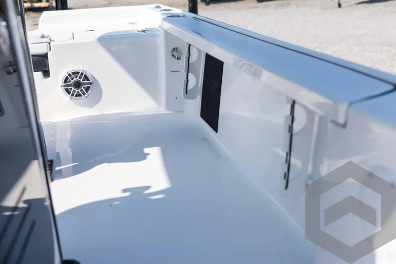 Slide: The Image of 2026 Tidewater 2410 Bay Max boat interior with speaker and storage compartments. - 48