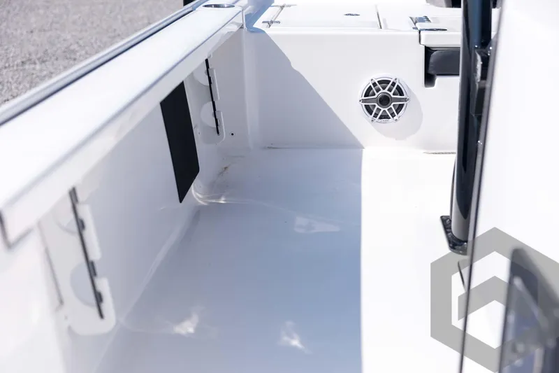 Slide: The Image of 2026 Tidewater 2410 Bay Max boat interior with speaker and storage compartments. - 49