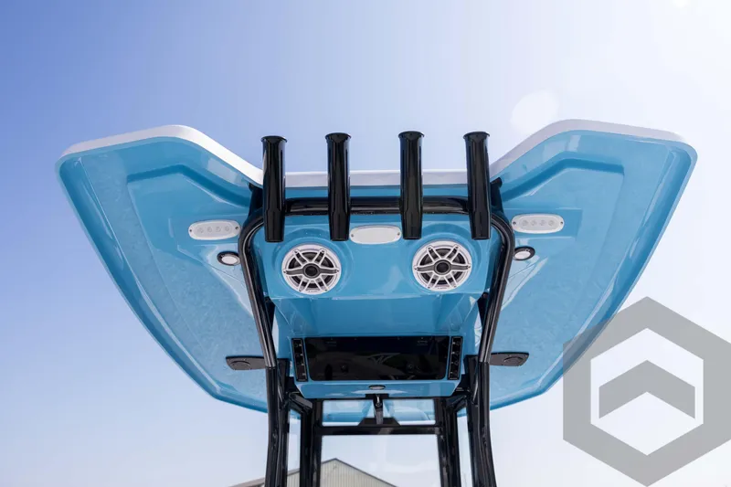 Slide: The Image of Tidewater 2410 Bay Max 2026 boat, blue T-top with speakers and rod holders. - 52