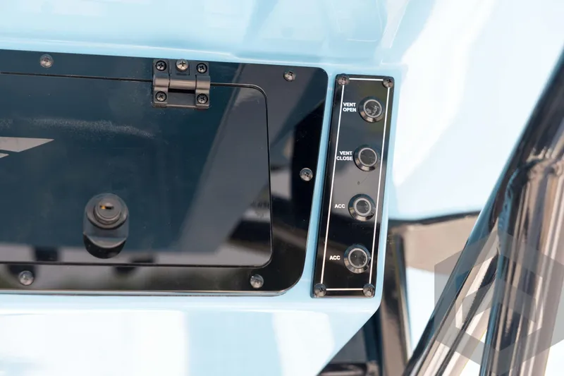 Slide: The Image of Control panel of 2026 Tidewater 2410 Bay Max boat with vent and accessory switches. - 55