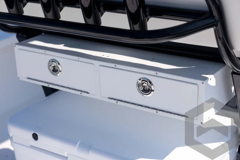 Slide: The Image of 2026 Tidewater 2410 Bay Max boat storage compartments with sleek design and chrome handles. - 59