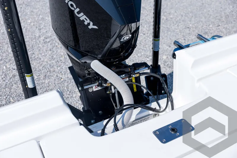 Slide: The Image of 2026 Tidewater 2410 Bay Max boat engine detail with Mercury motor and hydraulic components. - 70