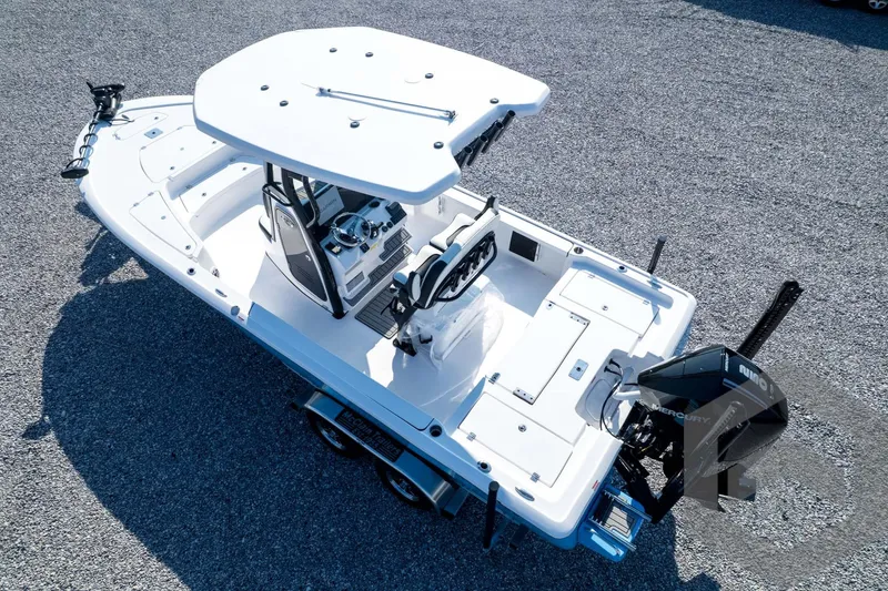 Slide: The Image of 2026 Tidewater 2410 Bay Max boat on trailer, featuring sleek design and modern equipment. - 77