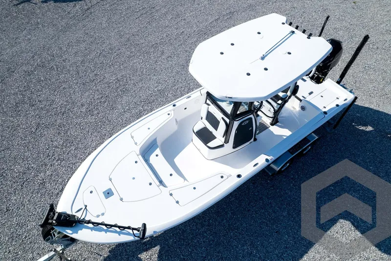 Slide: The Image of 2026 Tidewater 2410 Bay Max boat, aerial view, sleek design, white hull, spacious deck. - 79