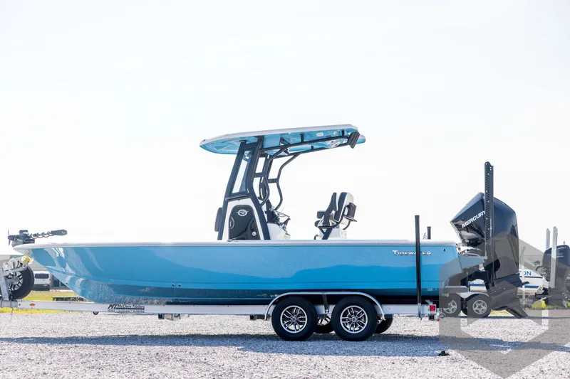 Slide: The Image of 2026 Tidewater 2410 Bay Max boat on trailer, blue hull, outdoor display. - 8
