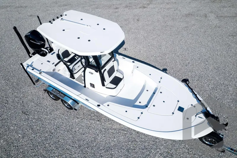 Slide: The Image of 2026 Tidewater 2410 Bay Max boat on trailer, aerial view, white hull, spacious deck. - 81