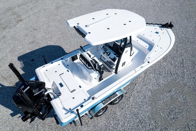 Slide: The Image of 2026 Tidewater 2410 Bay Max boat on trailer, aerial view, showcasing deck and console. - 83