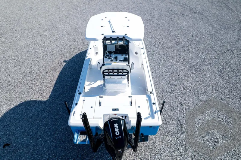 Slide: The Image of 2026 Tidewater 2410 Bay Max boat, aerial view, showcasing deck and Mercury engine. - 84