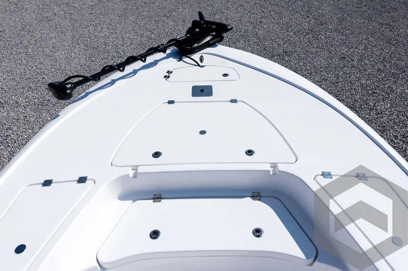 Slide: The Image of 2026 Tidewater 2410 Bay Max boat deck with storage compartments and trolling motor. - 9