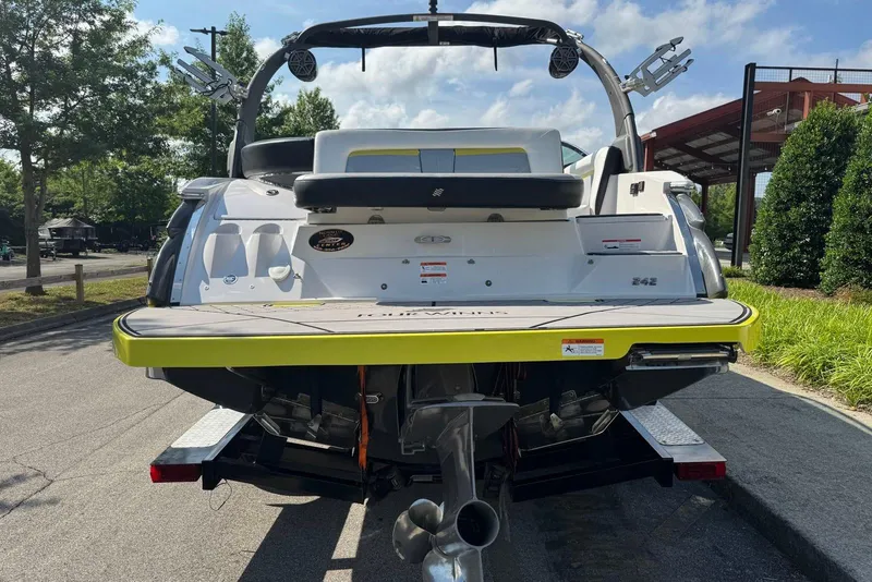 Slide: The Image of 2017 Four Winns TS242 boat rear view, parked on a sunny day. - 5