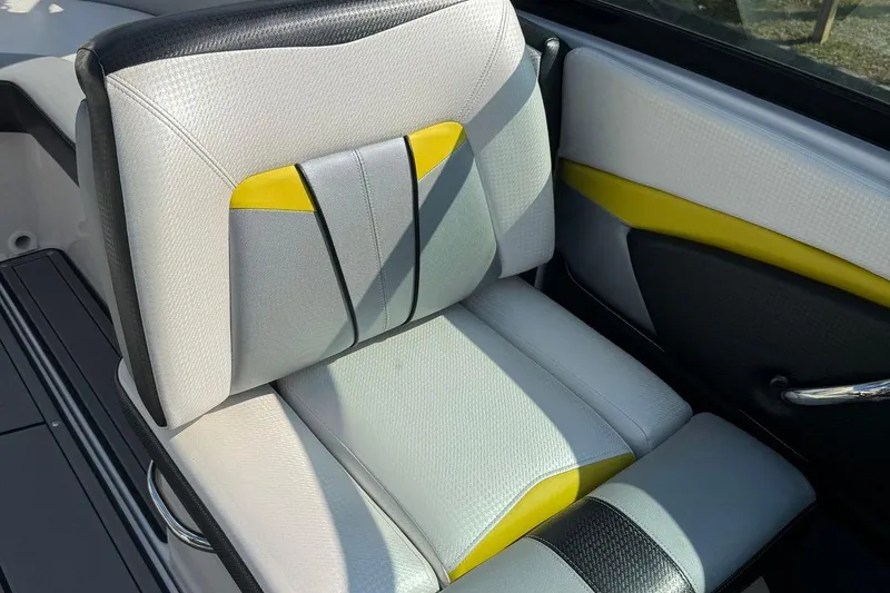 Slide: The Image of 2017 Four Winns TS242 boat seat with gray, yellow, and black upholstery. - 7