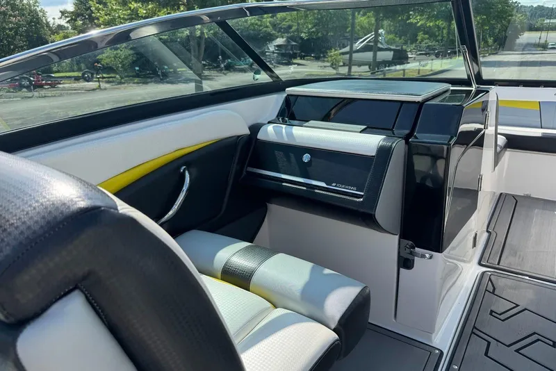 Slide: The Image of Interior of 2017 Four Winns TS242 boat with sleek seating and modern dashboard design. - 9