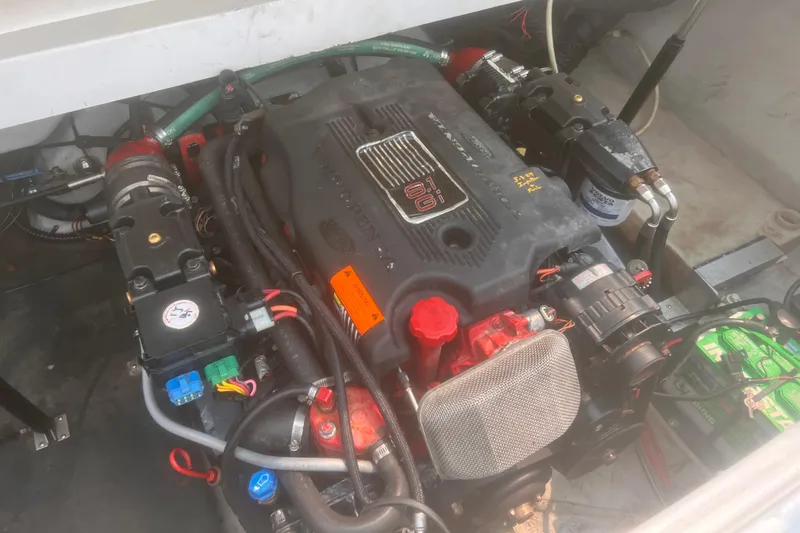 Slide: The Image of Engine compartment of a 2003 Cobalt 263 boat, featuring detailed components and wiring. - 18