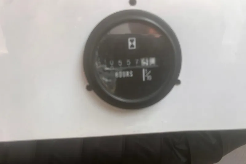 Slide: The Image of Hour meter on a 2003 Coblat 263, displaying usage hours. - 19