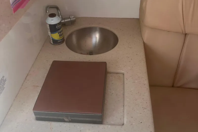 Slide: The Image of Small sink area with countertop and brown case, Cobalt 263, 2003 model. - 22