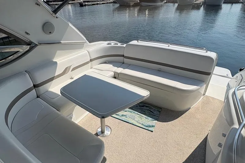 Slide: The Image of 2001 Formula 400ss boat interior with white seating and dashboard, docked at marina. - 10