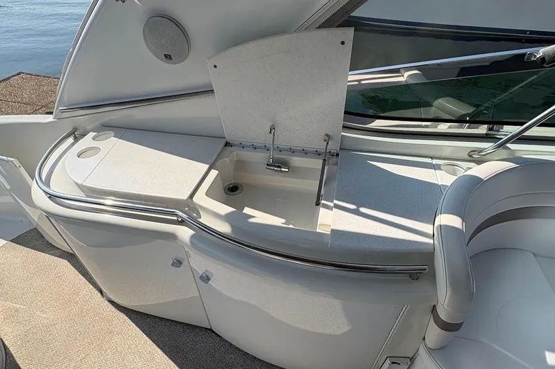 Slide: The Image of Interior of a 2001 Formula 400ss boat with plush seating and kitchenette. - 11