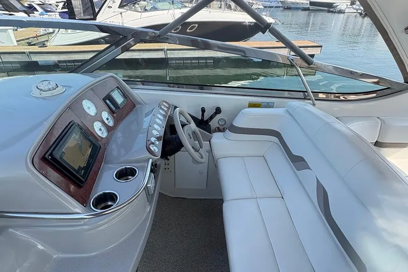 Slide: The Image of 2001 Formula 400ss yacht interior with kitchenette, sink, microwave, and seating area. - 12