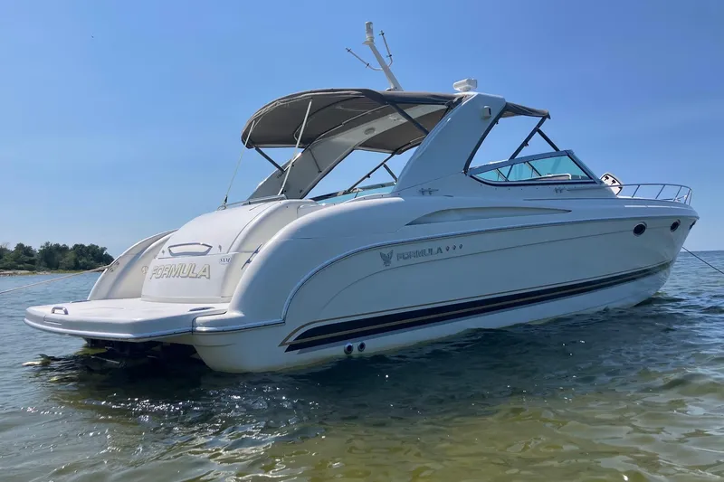 Slide: The Image of Cockpit of a 2001 Formula 400ss boat with steering wheel and control panel. - 2