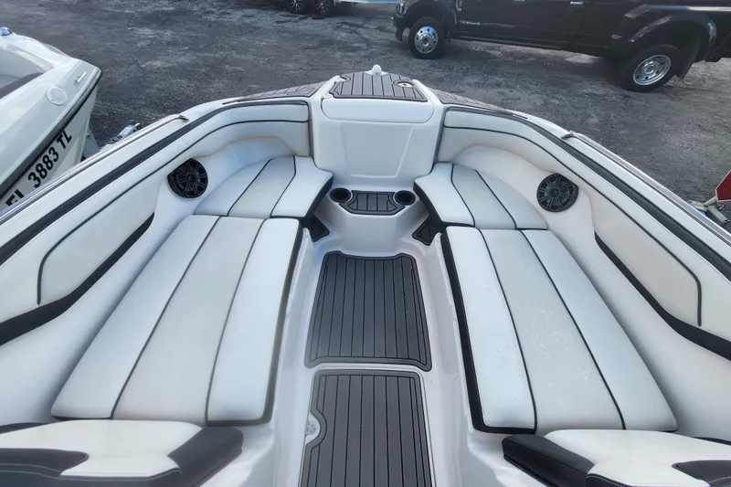 Slide: The Image of 2018 Yamaha Boats SX210 interior with white seating and black accents. - 8
