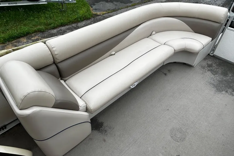 Slide: The Image of 2009 Harris CRUSIER 220 boat seating, beige and brown upholstery, outdoor setting. - 8