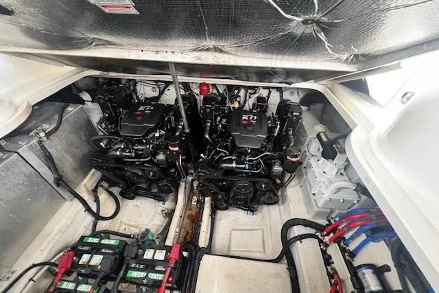 Slide: The Image of Engine compartment of a 2006 Sea Ray 300 Sundancer with dual engines and batteries. - 28