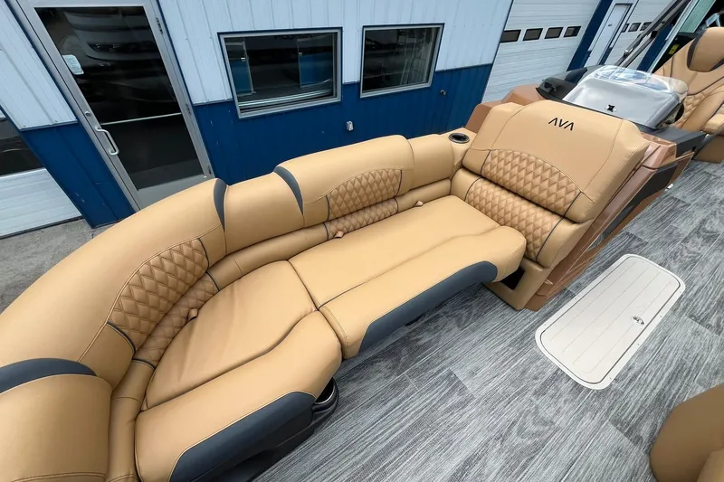 Slide: The Image of Luxurious seating on 2025 Avalon Catalina Quad Lounger Shift Windshield boat, featuring tan upholstery. - 10