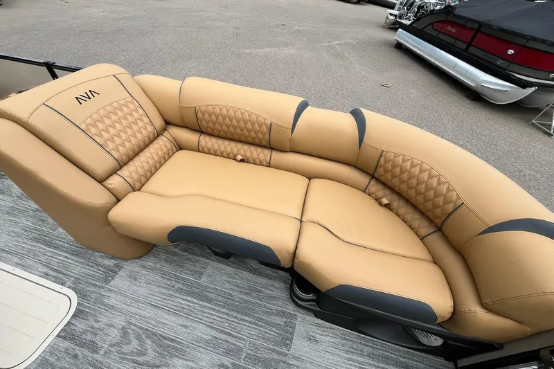Slide: The Image of Luxurious tan seating on 2025 Avalon Catalina Quad Lounger boat, featuring quilted design and modern style. - 11