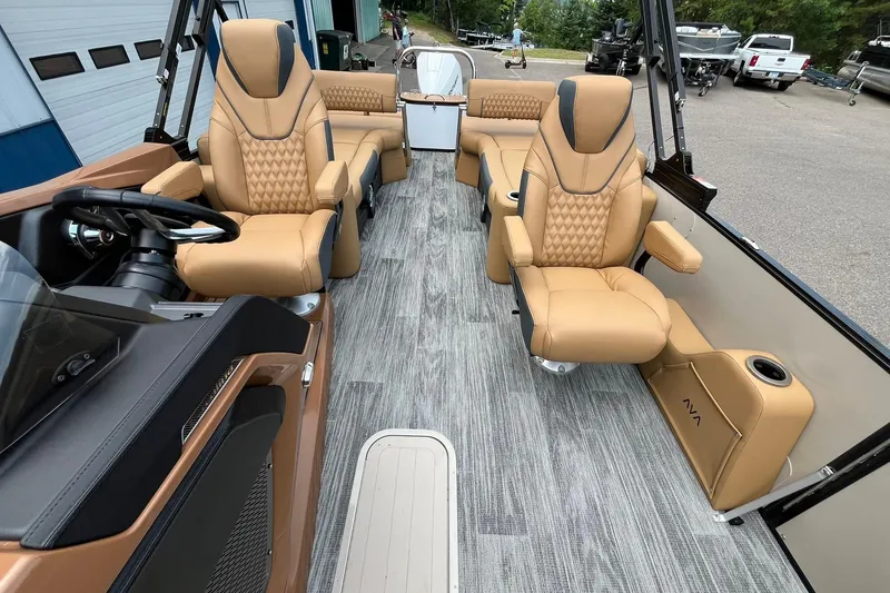 Slide: The Image of Luxurious interior of 2025 Avalon Catalina Quad Lounger Shift Windshield boat with tan seating. - 12