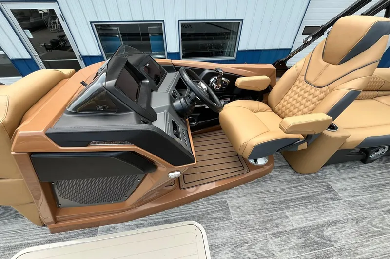 Slide: The Image of 2025 Avalon Catalina Quad Lounger Shift Windshield interior with luxurious tan seating and modern dashboard. - 13