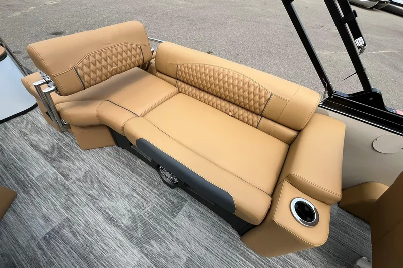 Slide: The Image of Luxurious tan seating on 2025 Avalon Catalina Quad Lounger Shift Windshield boat. - 17