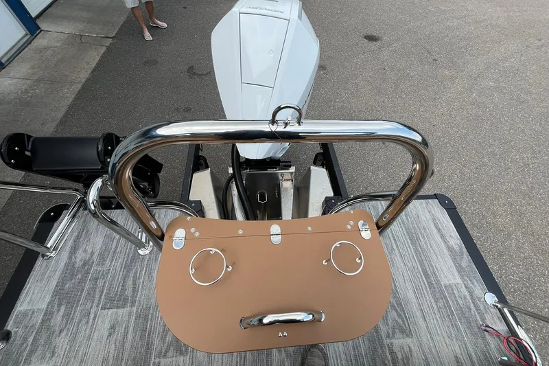 Slide: The Image of 2025 Avalon Catalina Quad Lounger Shift Windshield boat, rear view with motor and deck details. - 20