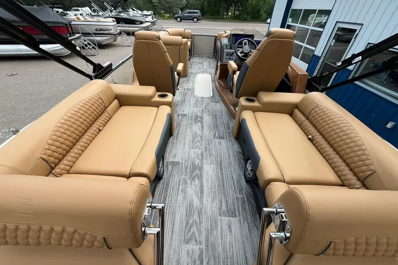 Slide: The Image of 2025 Avalon Catalina Quad Lounger with tan seating and modern interior design. - 21
