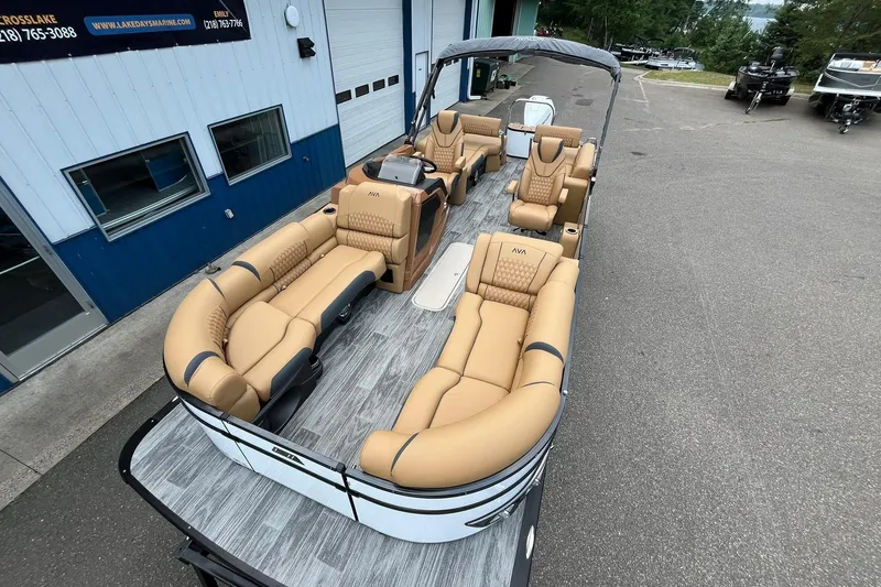 Slide: The Image of 2025 Avalon Catalina Quad Lounger Shift Windshield pontoon boat with luxurious tan seating. - 7