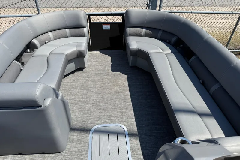 Slide: The Image of 2024 Bennington 23LSB pontoon boat interior with spacious gray seating. - 7