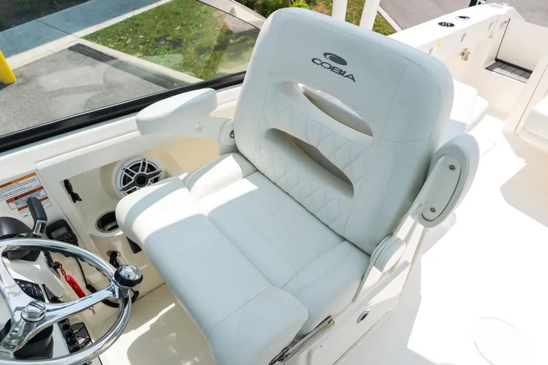Slide: The Image of Dashboard of 2023 Cobia 240 Dual Console with Garmin and Yamaha displays. - 24