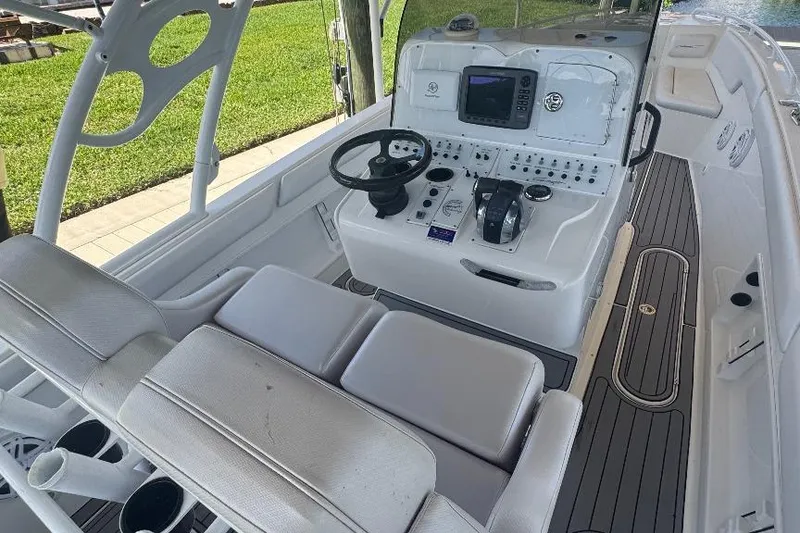 Slide: The Image of Modern boat cockpit with steering wheel, control panel, and seating, Concept 32, 2012 model. - 11