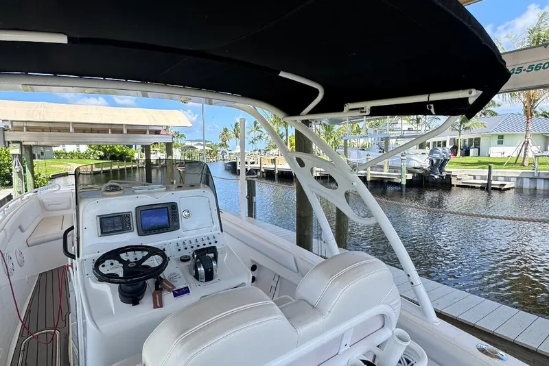 Slide: The Image of Interior view of a 2012 Concept 32 boat docked by a canal. - 12