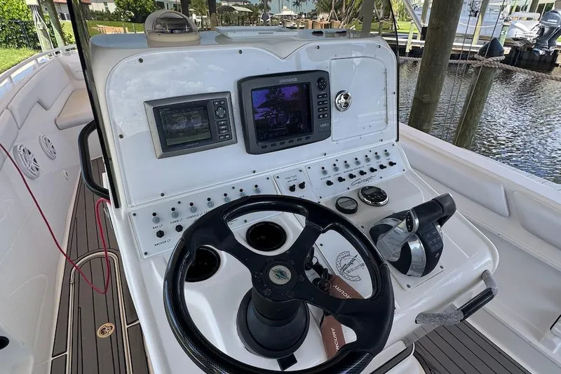 Slide: The Image of Boat cockpit with steering wheel, control panel, and navigation screens, Concept 32, 2012 model. - 14