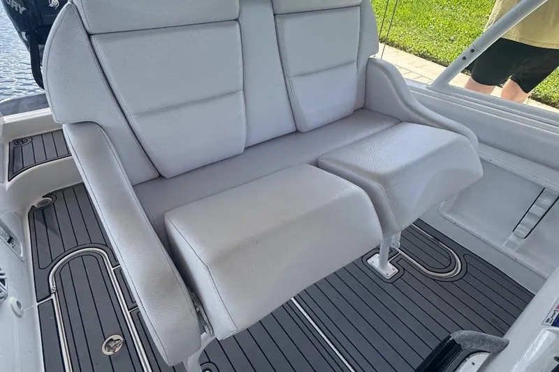 Slide: The Image of White cushioned boat seat on Concept 32, 2012 model, with gray flooring. - 16