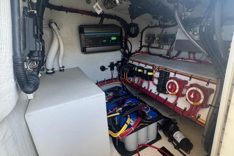 Slide: The Image of Electrical system inside a 2012 Concept 32 boat, featuring batteries and wiring. - 20