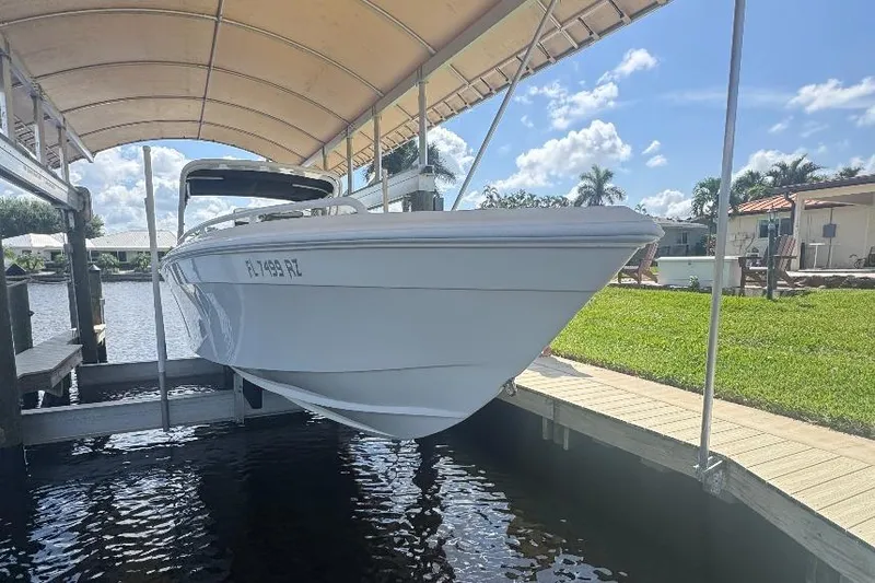 Slide: The Image of 2012 Concept 32 boat docked under canopy on sunny day. - 7