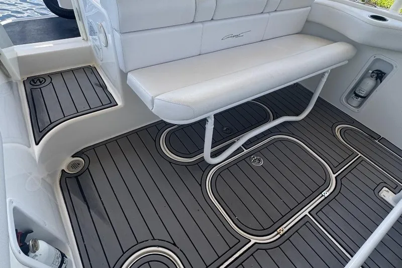 Slide: The Image of White seating and gray deck flooring on a 2012 Concept 32 boat. - 9