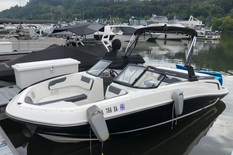 The Image of 2021 Bayliner VR5 Bowrider I/O docked at marina, surrounded by other boats. - 0